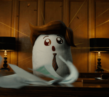 Ein animiertes Puffreiskorn mit überraschtem Gesichtsausdruck, Krawatte und braunen Haaren sitzt an einem Schreibtisch.